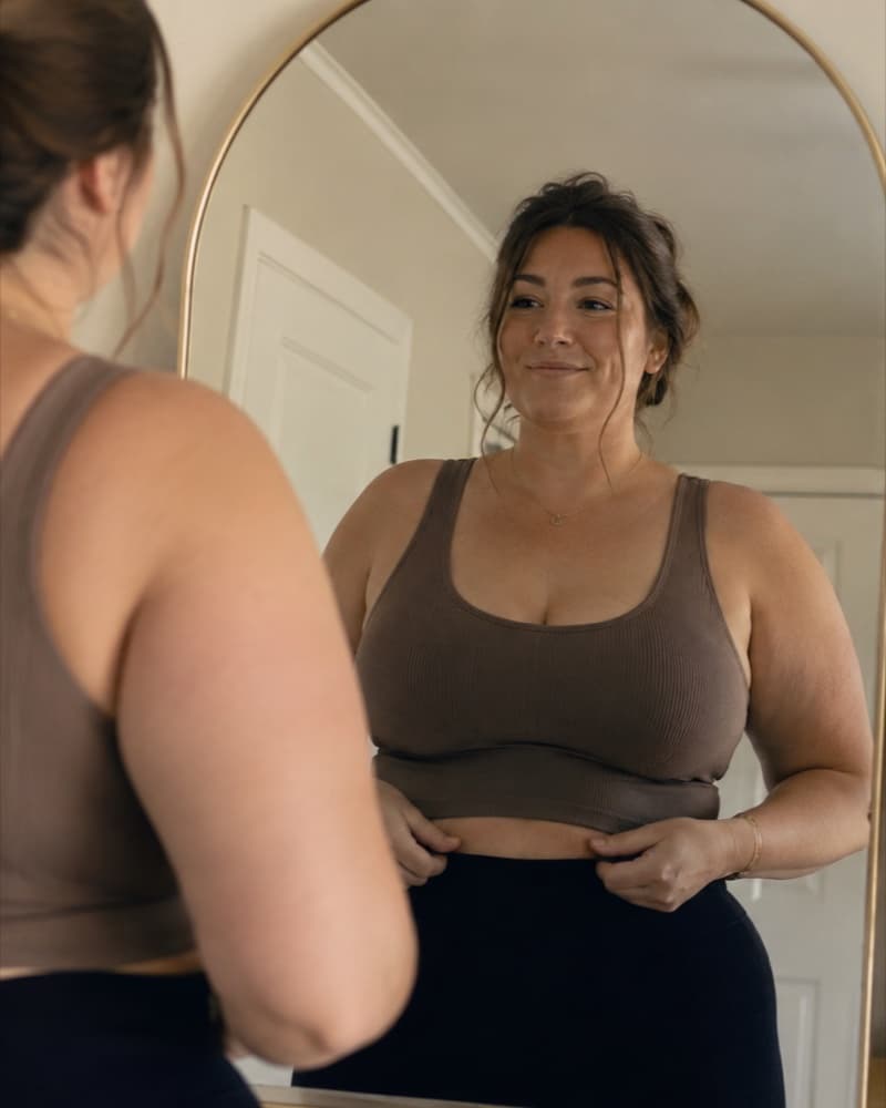 Woman getting ready at a bathroom mirror